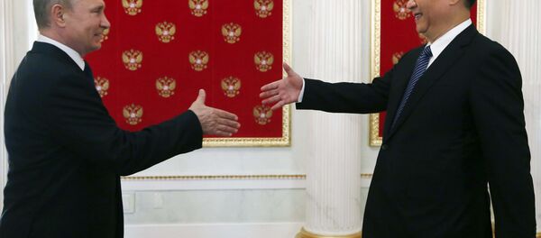 Russian President Vladimir Putin (L) welcomes his Chinese counterpart Xi Jinping during a meeting at the Kremlin in Moscow, Russia Russia July 3, 2017. Russian President Vladimir Putin (L) welcomes his Chinese counterpart Xi Jinping during a meeting at the Kremlin in Moscow, Russia Russia July 3, 2017. - Sputnik International