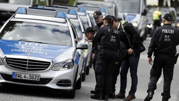 Police officers gather around the fair halls for the upcoming G-20 summit in Hamburg, Germany - Sputnik International
