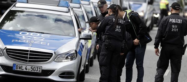 Police officers gather around the fair halls for the upcoming G-20 summit in Hamburg, Germany Police officers gather around the fair halls for the upcoming G-20 summit in Hamburg, Germany - Sputnik International