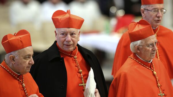 Italian Cardinal Francesco Coccopalmerio, second from left, attends a Mass for the election of a new pope celebrated by Cardinal Angelo Sodano, not pictured, inside St. Peter's Basilica, at the Vatican, Tuesday, March 12, 2013. - Sputnik International