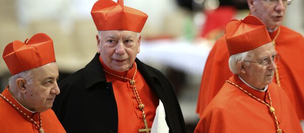Italian Cardinal Francesco Coccopalmerio, second from left, attends a Mass for the election of a new pope celebrated by Cardinal Angelo Sodano, not pictured, inside St. Peter's Basilica, at the Vatican, Tuesday, March 12, 2013. Italian Cardinal Francesco Coccopalmerio, second from left, attends a Mass for the election of a new pope celebrated by Cardinal Angelo Sodano, not pictured, inside St. Peter's Basilica, at the Vatican, Tuesday, March 12, 2013. - Sputnik International