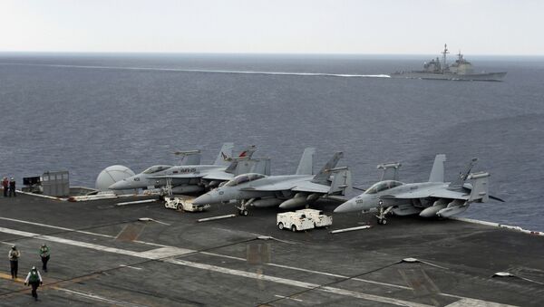 (File) The USS Normandy sails in the Bay of Bengal as U.S. Navy fighter aircrafts are stationed at the flight deck of aircraft carrier USS Theodore Roosevelt (CVN 71) during Exercise Malabar 2015, some 152 miles off eastern coast of Chennai, India, Saturday, Oct. 17, 2015 - Sputnik International