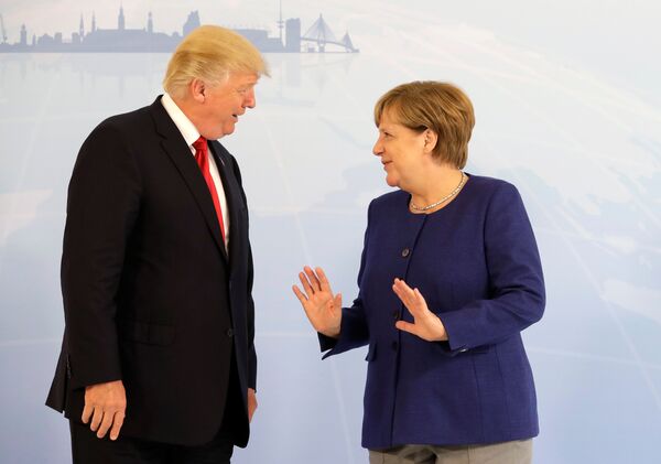 German Chancellor Angela Merkel meets U.S. President Donald Trump on the eve of the G-20 summit in Hamburg, Germany, July 6, 2017 - Sputnik International