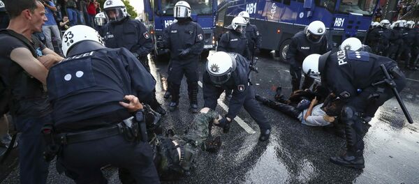 German riot police detain protesters during the demonstrations during the G20 summit in Hamburg, Germany, July 6, 2017 German riot police detain protesters during the demonstrations during the G20 summit in Hamburg, Germany, July 6, 2017 - Sputnik International