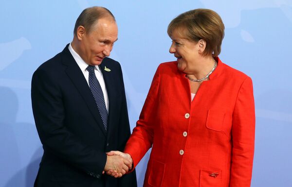 German Chancellor Angela Merkel greets Russian President Vladimir Putin as he arrives for the G20 leaders summit in Hamburg, Germany July 7, 2017 German Chancellor Angela Merkel greets Russian President Vladimir Putin as he arrives for the G20 leaders summit in Hamburg, Germany July 7, 2017 - Sputnik International