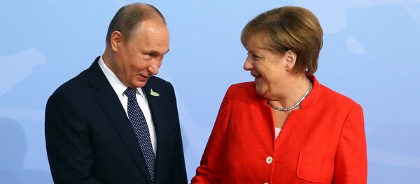 German Chancellor Angela Merkel greets Russian President Vladimir Putin as he arrives for the G20 leaders summit in Hamburg, Germany July 7, 2017 German Chancellor Angela Merkel greets Russian President Vladimir Putin as he arrives for the G20 leaders summit in Hamburg, Germany July 7, 2017 - Sputnik International