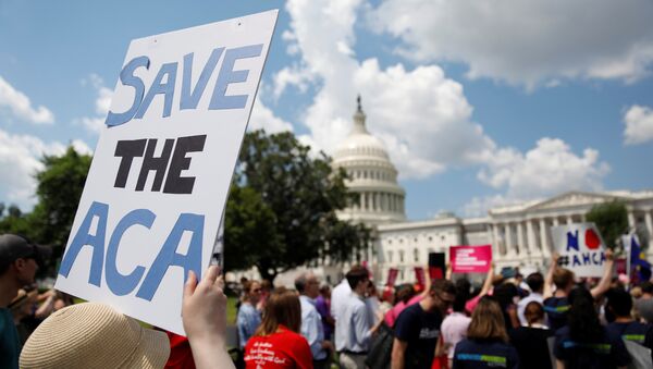 Protestors gather during a demonstration against the Republican repeal of the Affordable Care Act, outside the U.S. Capitol in Washington, U.S., June 21, 2017 - Sputnik International