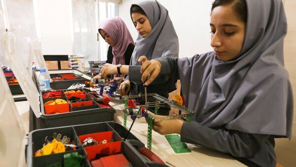 Members of Afghan robotics girls team which was denied entry into the United States for a competition, work on their robots in Herat province, Afghanistan July 4, 2017 - Sputnik International