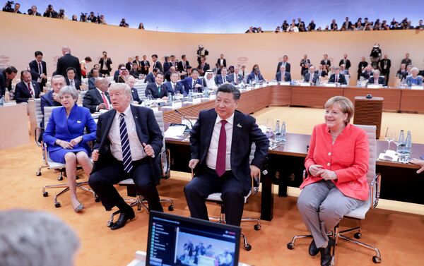 (L-R) US President Donald Trump, China's President Xi Jinping, German Chancellor Angela Merkel, Argentinia's President Mauricio Macri and Australia's Prime Minister Malcolm Turnbull turn around for photographers at the start of the first working sessionthe G20 summit in Hamburg, Germany, July 7, 2017 - Sputnik International
