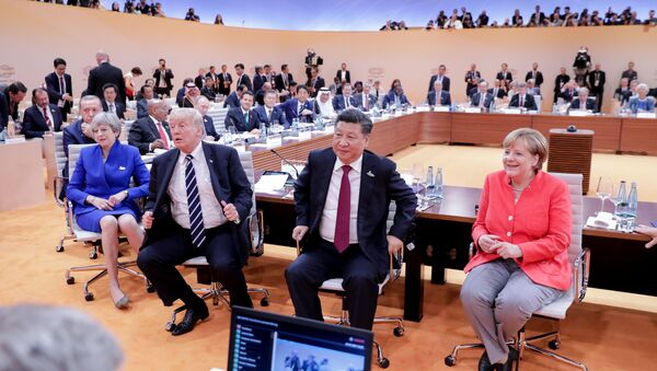 (L-R) US President Donald Trump, China's President Xi Jinping, German Chancellor Angela Merkel, Argentinia's President Mauricio Macri and Australia's Prime Minister Malcolm Turnbull turn around for photographers at the start of the first working sessionthe G20 summit in Hamburg, Germany, July 7, 2017 - Sputnik International
