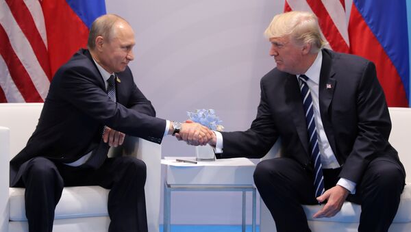 U.S. President Donald Trump shakes hands with Russia's President Vladimir Putin during their bilateral meeting at the G20 summit in Hamburg, Germany July 7, 2017 - Sputnik International