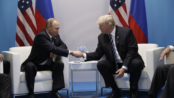 President Donald Trump shakes hands with Russian President Vladimir Putin at the G20 Summit, Friday, July 7, 2017, in Hamburg - Sputnik International