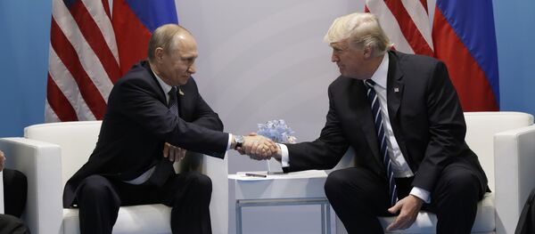 President Donald Trump shakes hands with Russian President Vladimir Putin at the G20 Summit, Friday, July 7, 2017, in Hamburg President Donald Trump shakes hands with Russian President Vladimir Putin at the G20 Summit, Friday, July 7, 2017, in Hamburg - Sputnik International
