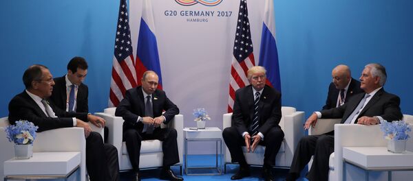 Russia's President Vladimir Putin sits next to U.S. President Donald Trump during their bilateral meeting at the G20 summit in Hamburg, Germany July 7, 2017 Russia's President Vladimir Putin sits next to U.S. President Donald Trump during their bilateral meeting at the G20 summit in Hamburg, Germany July 7, 2017 - Sputnik International
