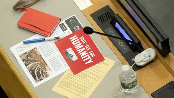 Leaflets are seen on a delegates desk before a vote by the conference to adopt a legally binding instrument to prohibit nuclear weapons, leading towards their total elimination, Friday, July 7, 2017 at United Nations headquarters - Sputnik International