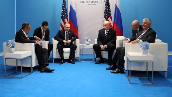 Russian President Vladimir Putin and President of the USA Donald Trump, third right, during their meeting on the sidelines of the G20 summit in Hamburg. Right: US Secretary if State Rex Tillerson; left: Russian Foreign Minister Sergei Lavrov. - Sputnik International