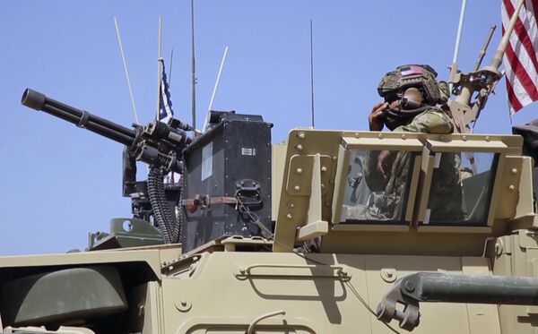 This Saturday, April. 29, 2017 still taken from video, shows an American soldier looking out of an armored vehicle in the northern village of Darbasiyah, Syria This Saturday, April. 29, 2017 still taken from video, shows an American soldier looking out of an armored vehicle in the northern village of Darbasiyah, Syria - Sputnik International