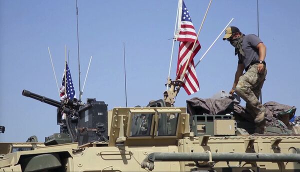 This Saturday, April. 29, 2017 still taken from video, shows an American soldier standing on an armored vehicle in the northern village of Darbasiyah, Syria This Saturday, April. 29, 2017 still taken from video, shows an American soldier standing on an armored vehicle in the northern village of Darbasiyah, Syria - Sputnik International