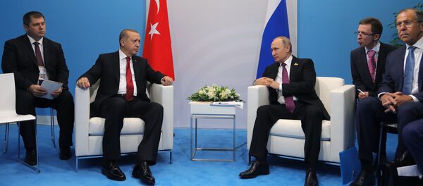 July 8, 2017. Russian President Vladimir Putin and President of Turkey Recep Tayyip Erdogan, second left, talk during their meeting on the sidelines of the G20 summit in Hamburg. Right: Russian Foreign Minister Sergei Lavrov - Sputnik International