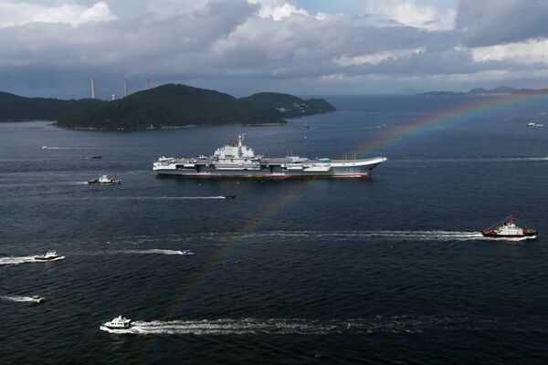 China's aircraft carrier Liaoning sails past a rainbow as it enters Hong Kong, China, July 7, 2017 - Sputnik International