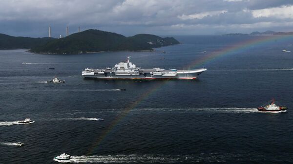 China's aircraft carrier Liaoning sails past a rainbow as it enters Hong Kong, China, July 7, 2017 - Sputnik International