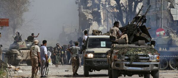 Members of Libyan National Army (LNA) gather after the liberation of Islamist militants' last stronghold in Benghazi, Libya, July 6, 2017 Members of Libyan National Army (LNA) gather after the liberation of Islamist militants' last stronghold in Benghazi, Libya, July 6, 2017 - Sputnik International