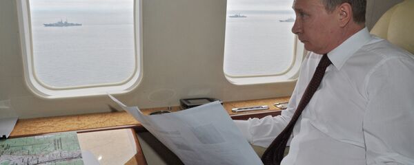 Russian President Vladimir Putin flying in a presidential aircraft - Sputnik International