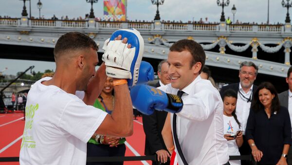 French President Emmanuel Macron (R) spars with a boxing partner in Paris, France, June 24, 2017 - Sputnik International