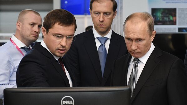 July 10, 2017. Russian President Vladimir Putin looks at Rostec Corporation's display during the 8th Innoprom International Industrial Trade Fair at the Yekaterinburg Expo International Exhibition Center. From left: Rostec Director for Special Commissions Vasily Brovko with Russian Minister of Industry and Trade Denis Manturov. - Sputnik International