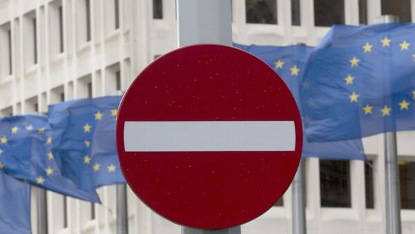EU flags flap in the wind behind a no entry traffic sign in front of EU headquarters in Brussels. - Sputnik International