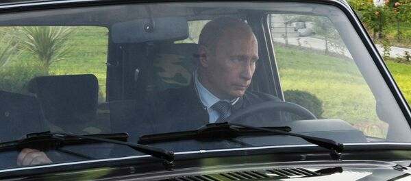 Vladimir Putin driving a Niva SUV in Sochi - Sputnik International