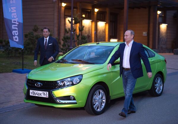 October 22, 2015. President Vladimir Putin (front) drove Lada Vesta, a new AVTOVAZ car, to the plenary session of the 12th annual meeting of the Valdai International Discussion Club in Krasnaya Polyana. Back: Bo Inge Andersson, President, AVTOVAZ. October 22, 2015. President Vladimir Putin (front) drove Lada Vesta, a new AVTOVAZ car, to the plenary session of the 12th annual meeting of the Valdai International Discussion Club in Krasnaya Polyana. Back: Bo Inge Andersson, President, AVTOVAZ. - Sputnik International