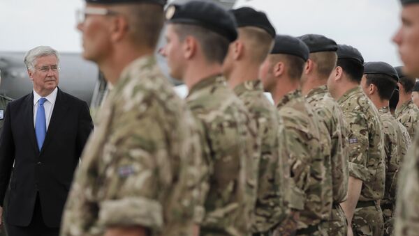 Britain's defense minister Michael Fallon reviews British military personnel at the Mihail Kogalniceanu air base, Romania, Wednesday, June 14, 2017. - Sputnik International