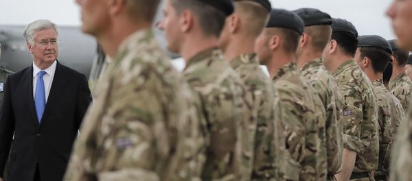 Britain's defense minister Michael Fallon reviews British military personnel at the Mihail Kogalniceanu air base, Romania, Wednesday, June 14, 2017. Britain's defense minister Michael Fallon reviews British military personnel at the Mihail Kogalniceanu air base, Romania, Wednesday, June 14, 2017. - Sputnik International
