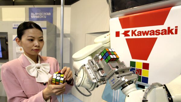 Japan's machinery maker Kawasaki Heavy Industries robot Cube-kun is seen solving a 3x3x3 Rubik's Cube during a demonstration in Tokyo - Sputnik International