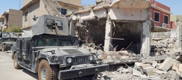 Iraqi army truck near house wreck in western Mosul, Iraq Iraqi army truck near house wreck in western Mosul, Iraq - Sputnik International