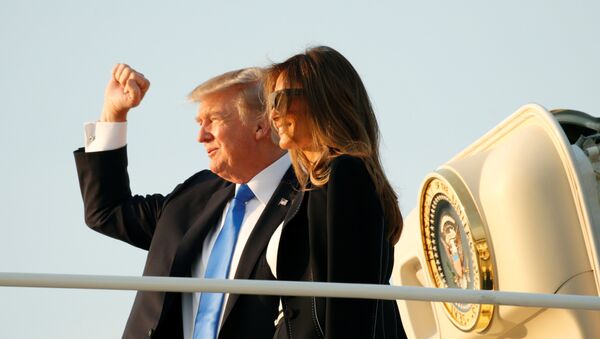 U.S. President Donald Trump and first lady Melania Trump board Air Force One as they depart Joint Base Andrews in Maryland, U.S., enroute to Paris July 12, 2017. - Sputnik International