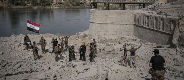 Iraqi Special Forces soldiers celebrate after reaching the bank of the Tigris river as their fight against Islamic State militants continues in parts of the Old City of Mosul, Iraq, Sunday, July 9, 2017. Iraqi Special Forces soldiers celebrate after reaching the bank of the Tigris river as their fight against Islamic State militants continues in parts of the Old City of Mosul, Iraq, Sunday, July 9, 2017. - Sputnik International