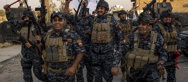 Members of the Iraqi federal police forces celebrate in the Old City of Mosul on July 10, 2017 after the government's announcement of the liberation of the embattled city from Islamic State (IS) group fighters. Members of the Iraqi federal police forces celebrate in the Old City of Mosul on July 10, 2017 after the government's announcement of the liberation of the embattled city from Islamic State (IS) group fighters. - Sputnik International