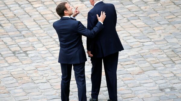 French President Emmanuel Macron and U.S. President Donald Trump attend a welcoming ceremony at the Invalides in Paris, France, July 13, 2017. - Sputnik International