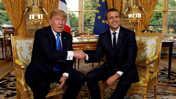 French President Emmanuel Macron and U.S. President Donald Trump (L) shake hands as they meet at the Elysee Palace in Paris, France, July 13, 2017. - Sputnik International