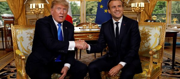 French President Emmanuel Macron and U.S. President Donald Trump (L) shake hands as they meet at the Elysee Palace in Paris, France, July 13, 2017. - Sputnik International