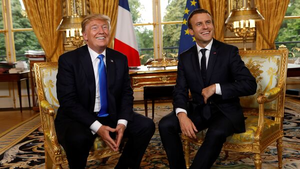 French President Emmanuel Macron and U.S. President Donald Trump (L) react as they meet at the Elysee Palace in Paris, France, July 13, 2017. - Sputnik International