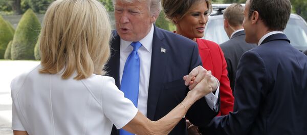 French President Emmanuel Macron, right, welcome First Lady Melania Trump while and his wife Brigitte, left, welcomes U.S President Donald Trump at Les Invalides museum in Paris Thursday, July 13, 2017. French President Emmanuel Macron, right, welcome First Lady Melania Trump while and his wife Brigitte, left, welcomes U.S President Donald Trump at Les Invalides museum in Paris Thursday, July 13, 2017. - Sputnik International
