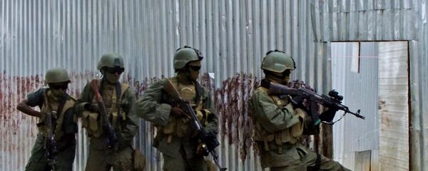 (File) Masked Somali national army (SNA) soldiers search through homes for al-Shabaab fighters, during an operation in Ealsha Biyaha, Somalia, Saturday, June, 2, 2012 (File) Masked Somali national army (SNA) soldiers search through homes for al-Shabaab fighters, during an operation in Ealsha Biyaha, Somalia, Saturday, June, 2, 2012 - Sputnik International