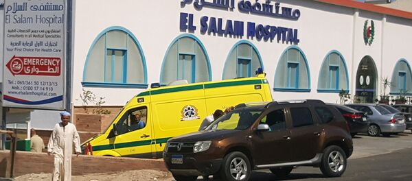 A man walks in front of an ambulance arriving at El Salam Hospital after an Egyptian man stabbed two German tourists to death and wounded four others at the beach of the Zahabia hotel, in Hurghada, south of the capital Cairo, Egypt, July 14, 2017 - Sputnik International