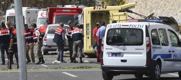 Turkish police officers work next to an overturned bus at the scene of a traffic accident (File) Turkish police officers work next to an overturned bus at the scene of a traffic accident (File) - Sputnik International