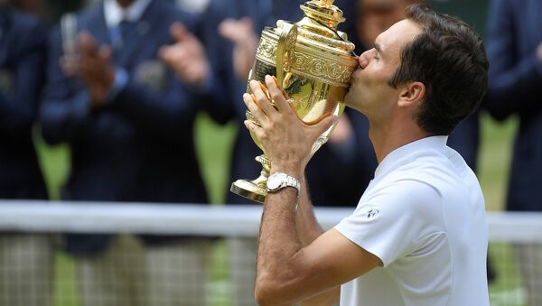 Tennis - Wimbledon - London, Britain - July 16, 2017 Switzerland’s Roger Federer celebrates with the trophy after winning the final against Croatia’s Marin Cilic - Sputnik International
