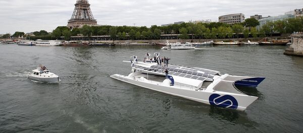 Energy Observer, the first self-sustainable eco-friendly boat, travels on the Seine river next to the Eiffel tower as it leaves for a world tour, in Paris, France July 15, 2017 Energy Observer, the first self-sustainable eco-friendly boat, travels on the Seine river next to the Eiffel tower as it leaves for a world tour, in Paris, France July 15, 2017 - Sputnik International