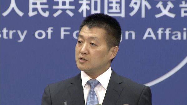 In this July 12, 2016 file image made from video, Lu Kang, the most senior spokesman of China's Foreign Affairs Ministry, speaks to reporters about the international tribunal's ruling on the South China Sea during a news briefing in Beijing - Sputnik International